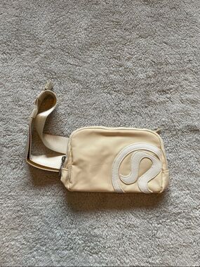 lululemon athletica Cream Crossbody Belt Bag with White Logo Accent